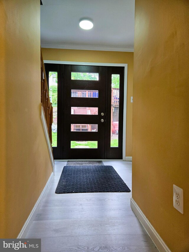 10920 Oakcrest Cir, New Market, MD 21774 - foyer featuring baseboards, wood finished floors, and ornamental molding