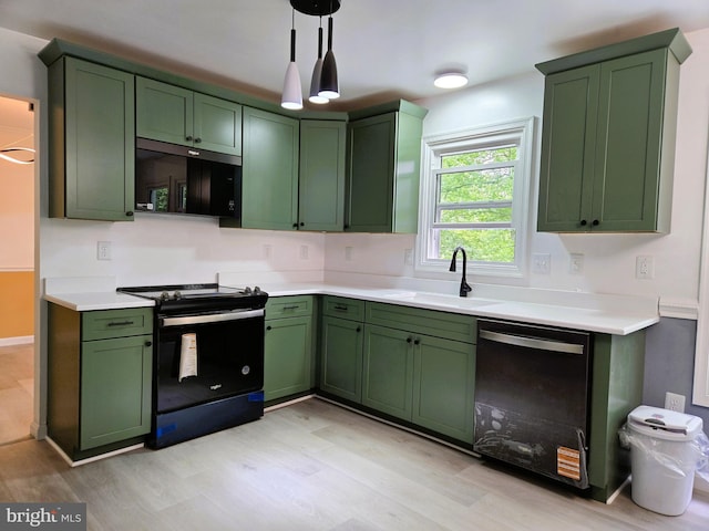 10920 Oakcrest Cir, New Market, MD 21774 - kitchen featuring green cabinets, black appliances, a sink, and light wood-style flooring
