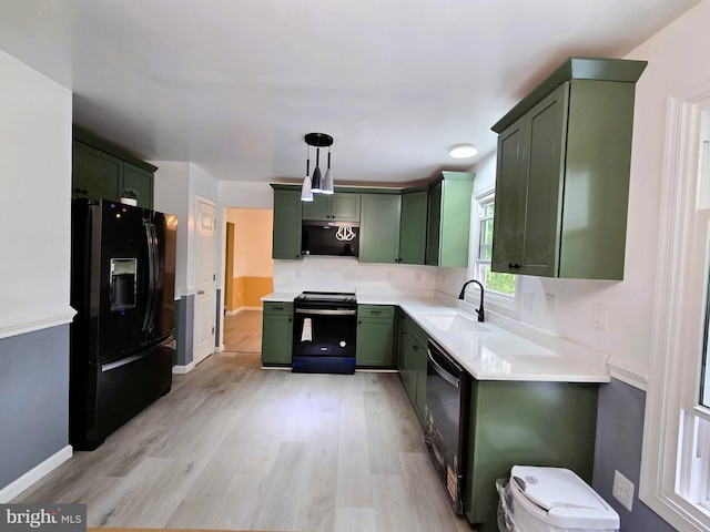10920 Oakcrest Cir, New Market, MD 21774 - kitchen with green cabinetry, black appliances, a sink, light wood finished floors, and light countertops