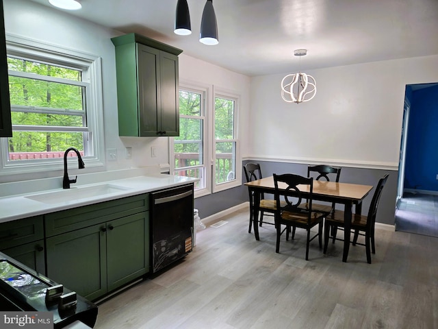 10920 Oakcrest Cir, New Market, MD 21774 - kitchen with green cabinetry, a sink, dishwasher, and light wood-style floors