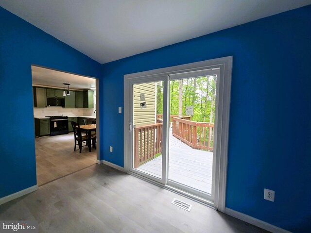10920 Oakcrest Cir, New Market, MD 21774 - doorway to outside with lofted ceiling, baseboards, and wood finished floors