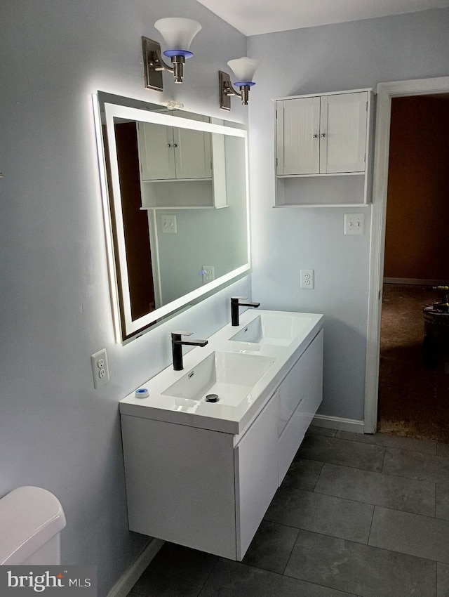 10920 Oakcrest Cir, New Market, MD 21774 - bathroom with toilet, double vanity, baseboards, and tile patterned floors