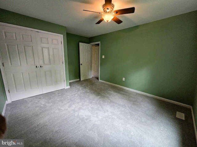10920 Oakcrest Cir, New Market, MD 21774 - unfurnished bedroom with baseboards, a closet, carpet flooring, and a ceiling fan