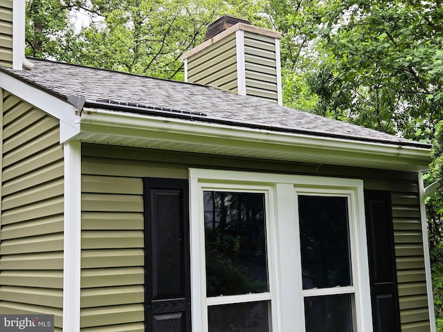 10920 Oakcrest Cir, New Market, MD 21774 - exterior view of a chimney, a shingled roof, gutters, and a downspout