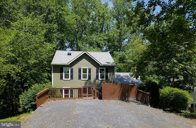 10920 Oakcrest Cir, New Market, MD 21774 - view of front of property featuring a shingled roof and a wooden deck