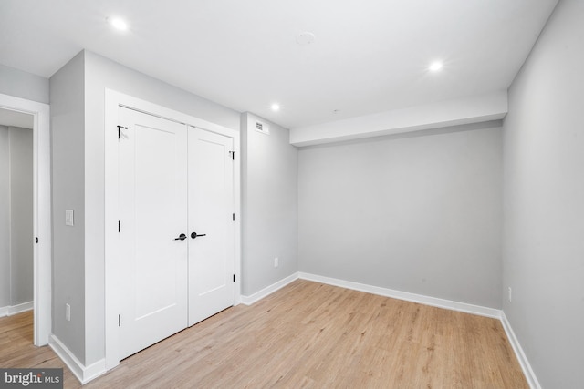 2639 Cecil B Moore Ave, Philadelphia, PA 19121 - unfurnished bedroom featuring light wood-style floors, a closet, baseboards, and recessed lighting