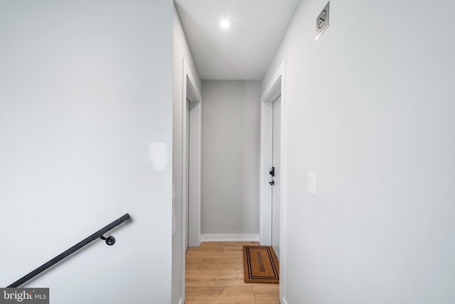 2639 Cecil B Moore Ave, Philadelphia, PA 19121 - hallway with light wood-type flooring, baseboards, recessed lighting, and an upstairs landing