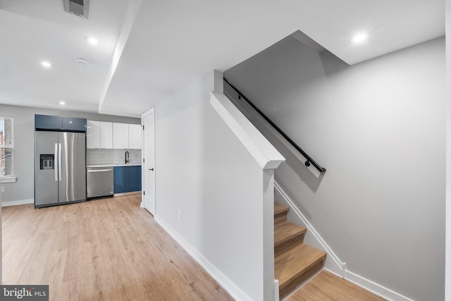 2639 Cecil B Moore Ave, Philadelphia, PA 19121 - stairs featuring wood finished floors, baseboards, and recessed lighting
