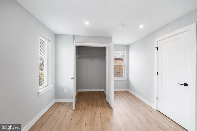 2639 Cecil B Moore Ave, Philadelphia, PA 19121 - unfurnished bedroom with light wood finished floors, baseboards, a closet, and recessed lighting
