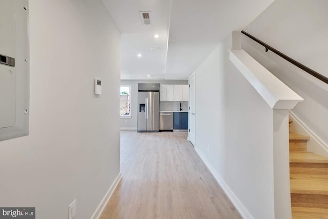 2639 Cecil B Moore Ave, Philadelphia, PA 19121 - hall featuring light wood-style flooring, recessed lighting, baseboards, and stairway