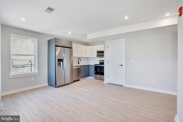 2639 Cecil B Moore Ave, Philadelphia, PA 19121 - kitchen featuring stainless steel appliances, light countertops, light wood-type flooring, baseboards, and recessed lighting