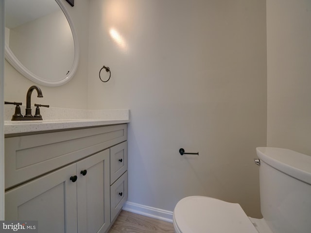 9309 Player Dr Unit 116, Laurel, MD 20708 - bathroom with toilet, vanity, and baseboards