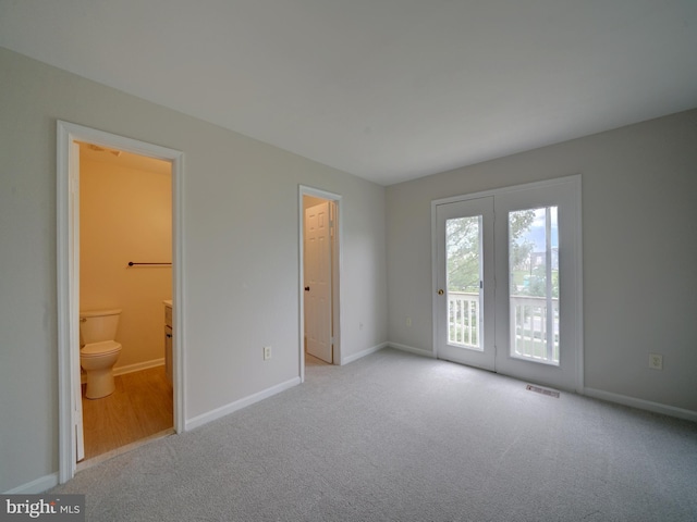 9309 Player Dr Unit 116, Laurel, MD 20708 - unfurnished bedroom with access to exterior, carpet floors, baseboards, and ensuite bathroom