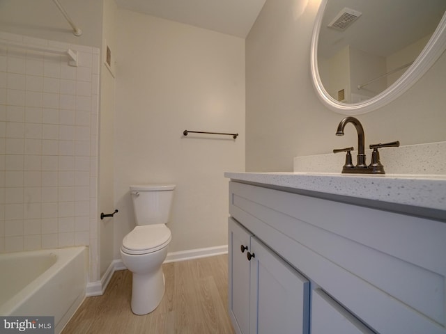 9309 Player Dr Unit 116, Laurel, MD 20708 - full bath featuring vanity, wood finished floors, toilet,  shower combination, and baseboards
