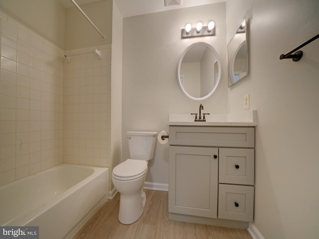 9309 Player Dr Unit 116, Laurel, MD 20708 - bathroom featuring vanity, toilet, shower / bath combination, baseboards, and wood finished floors