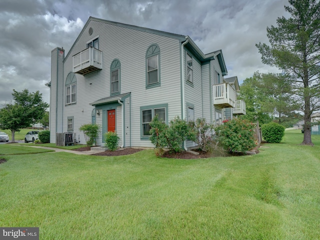 9309 Player Dr Unit 116, Laurel, MD 20708 - view of front of home featuring a balcony, a front yard, and cooling unit