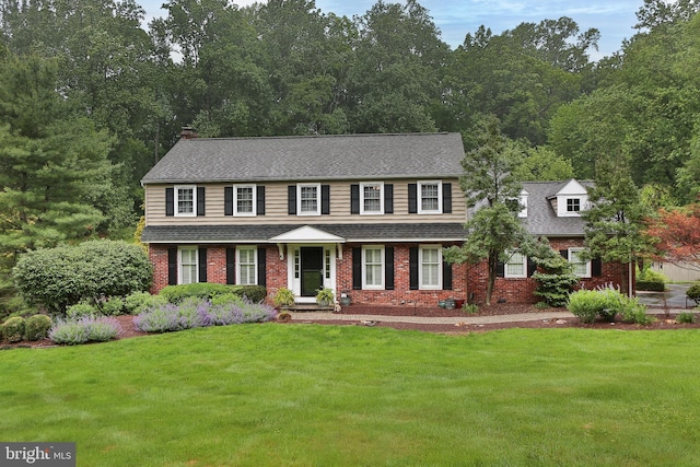 3195 Pelham Pl, Doylestown, PA 18902 - view of front of house featuring a front yard, brick siding, and roof with shingles