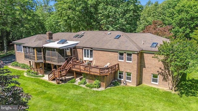 10060 Hampton Rd, Fairfax Station, VA 22039 - back of house with a sunroom, a deck, brick siding, and a yard