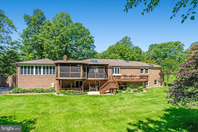 10060 Hampton Rd, Fairfax Station, VA 22039 - rear view of property featuring a sunroom, brick siding, a wooden deck, stairway, and a yard