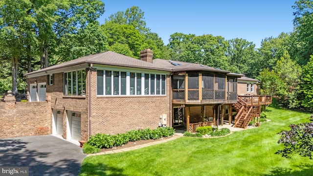 10060 Hampton Rd, Fairfax Station, VA 22039 - rear view of house featuring a sunroom, asphalt driveway, brick siding, a chimney, and stairs