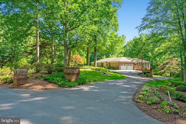 10060 Hampton Rd, Fairfax Station, VA 22039 - view of front of property featuring a garage and asphalt driveway