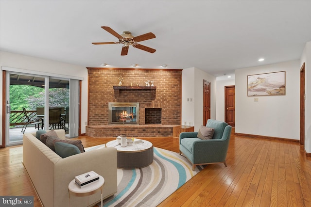 10060 Hampton Rd, Fairfax Station, VA 22039 - living room featuring light wood-type flooring, a ceiling fan, a brick fireplace, and recessed lighting