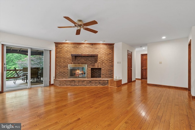 10060 Hampton Rd, Fairfax Station, VA 22039 - unfurnished living room featuring hardwood / wood-style flooring, a ceiling fan, a brick fireplace, and recessed lighting