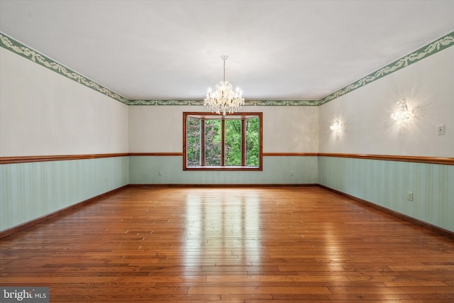 10060 Hampton Rd, Fairfax Station, VA 22039 - unfurnished room featuring wood-type flooring and a chandelier