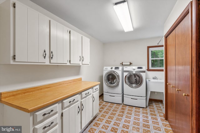 10060 Hampton Rd, Fairfax Station, VA 22039 - laundry area featuring washing machine and dryer and cabinet space
