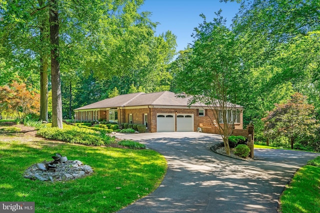 10060 Hampton Rd, Fairfax Station, VA 22039 - ranch-style home featuring an attached garage, driveway, brick siding, and a front lawn