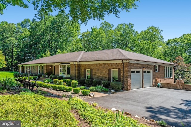 10060 Hampton Rd, Fairfax Station, VA 22039 - ranch-style home with an attached garage, driveway, and brick siding