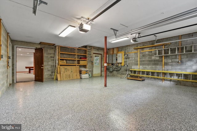 10060 Hampton Rd, Fairfax Station, VA 22039 - garage with concrete block wall and a garage door opener