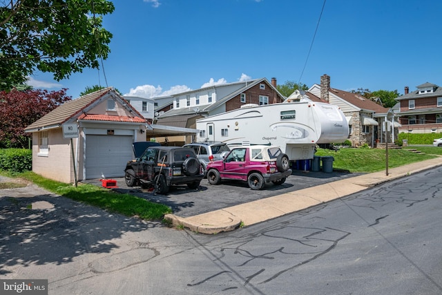 935 Grove St, Reading, PA 19605 - view of front of house featuring a residential view, a garage, a carport, and driveway