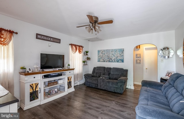 935 Grove St, Reading, PA 19605 - living area featuring arched walkways, a ceiling fan, and dark wood-type flooring