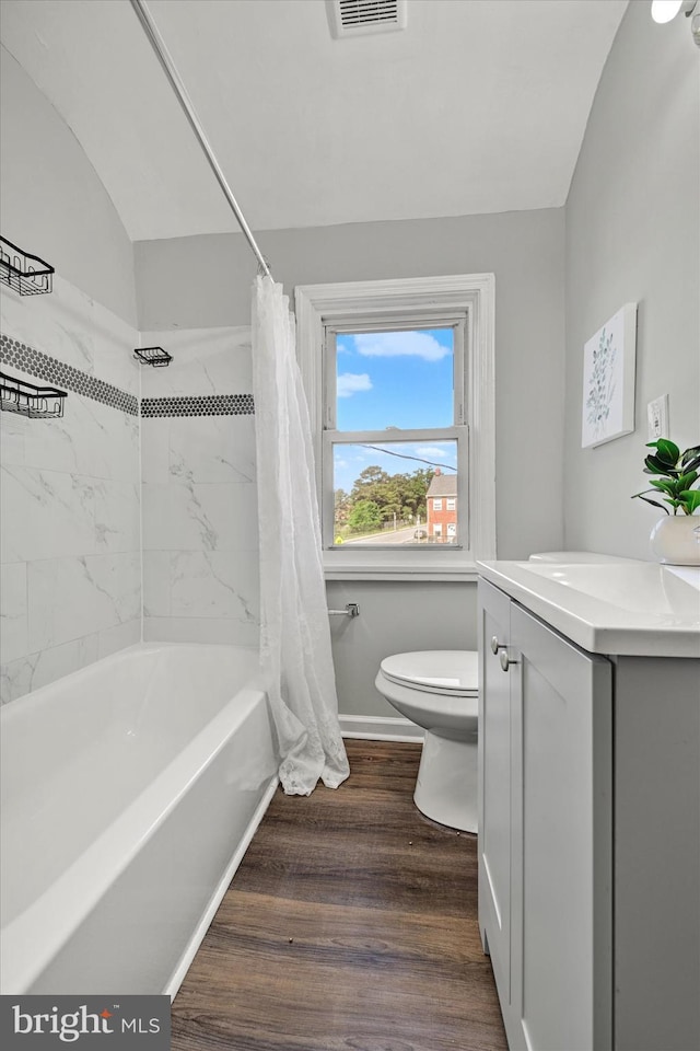 1076 Tunbridge Rd, Baltimore, MD 21212 - full bathroom with toilet, vanity, shower / bath combo, wood finished floors, and baseboards