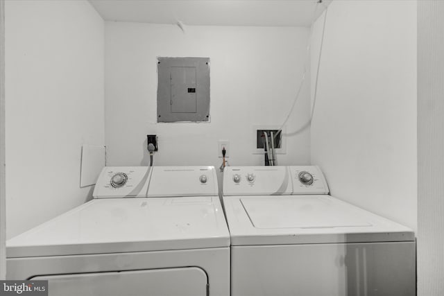 1076 Tunbridge Rd, Baltimore, MD 21212 - washroom featuring electric panel and washer and dryer