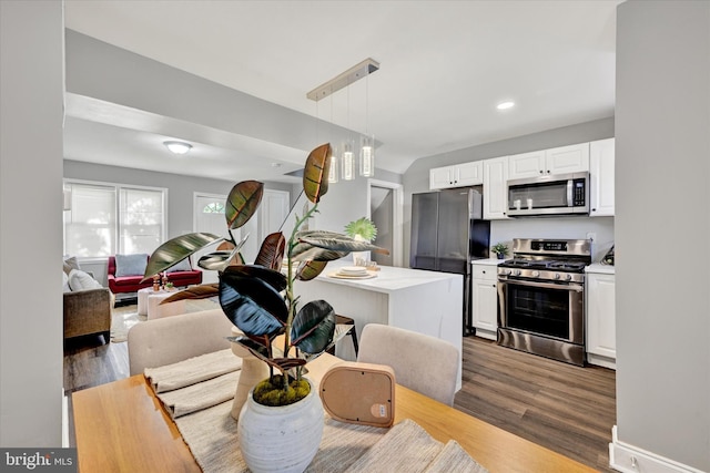 1076 Tunbridge Rd, Baltimore, MD 21212 - kitchen featuring stainless steel appliances, wood finished floors, light countertops, white cabinets, and recessed lighting