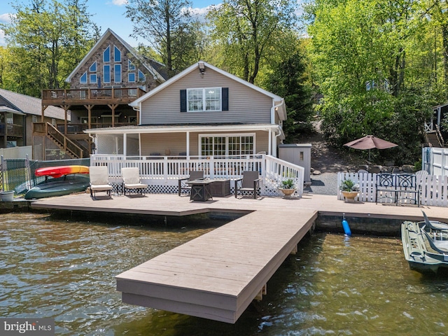 34 S Lake Dr, Lake Harmony, PA 18624 - rear view of house with a deck with water view