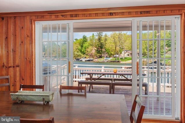 34 S Lake Dr, Lake Harmony, PA 18624 - dining space featuring a water view, wood walls, and healthy amount of natural light
