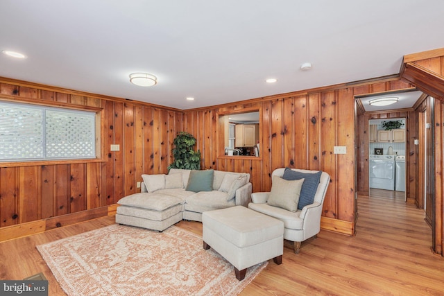34 S Lake Dr, Lake Harmony, PA 18624 - living area featuring washing machine and dryer, wood walls, light wood-type flooring, baseboards, and recessed lighting
