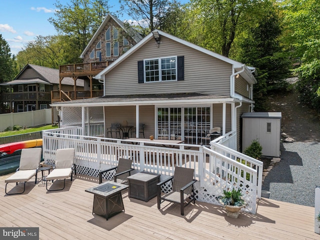 34 S Lake Dr, Lake Harmony, PA 18624 - back of house featuring a deck and an outdoor fire pit