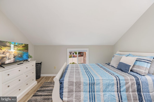 34 S Lake Dr, Lake Harmony, PA 18624 - bedroom with light wood finished floors, lofted ceiling, and baseboards