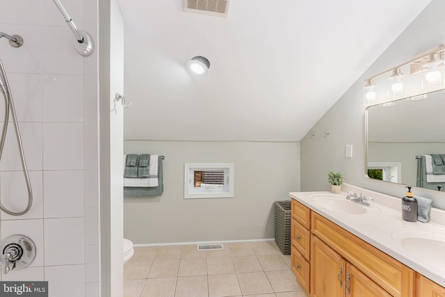 34 S Lake Dr, Lake Harmony, PA 18624 - full bath with double vanity, toilet, lofted ceiling, a shower, and tile patterned flooring