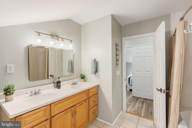 34 S Lake Dr, Lake Harmony, PA 18624 - full bathroom featuring tile patterned flooring, double vanity, shower / bath combo, and lofted ceiling