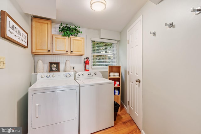 34 S Lake Dr, Lake Harmony, PA 18624 - laundry room with cabinet space, washing machine and dryer, and light wood-style flooring