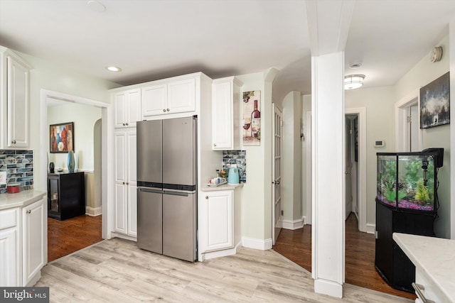 153 Sheridan Rd, Hamilton, NJ 08619 - kitchen with freestanding refrigerator, arched walkways, light countertops, and recessed lighting