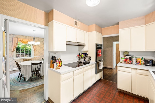 213 Rices Mill Rd, Wyncote, PA 19095 - kitchen featuring wallpapered walls, black electric stovetop, double oven, light countertops, and white cabinetry