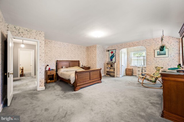 213 Rices Mill Rd, Wyncote, PA 19095 - bedroom featuring wallpapered walls, carpet, and arched walkways