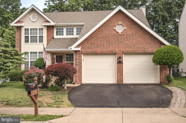 9348 Amaryllis Ave, Manassas, VA 20110 - traditional-style home featuring brick siding and asphalt driveway