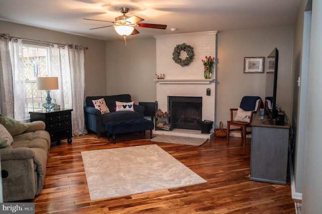 9348 Amaryllis Ave, Manassas, VA 20110 - living room featuring dark wood finished floors, a fireplace, and ceiling fan
